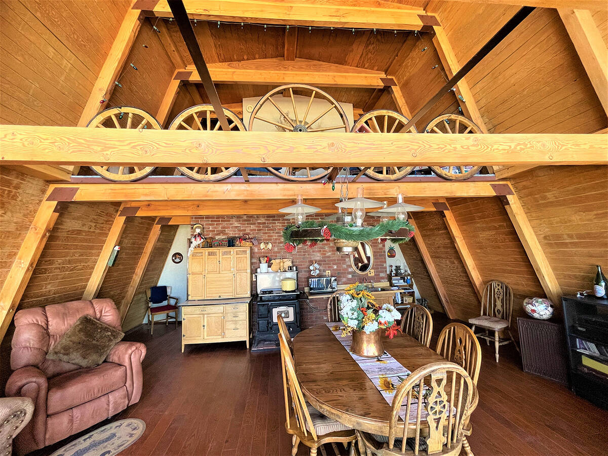 The cabin features a 300-pound custom wagon-wheel display. The grandiose fixture gives the dini ...