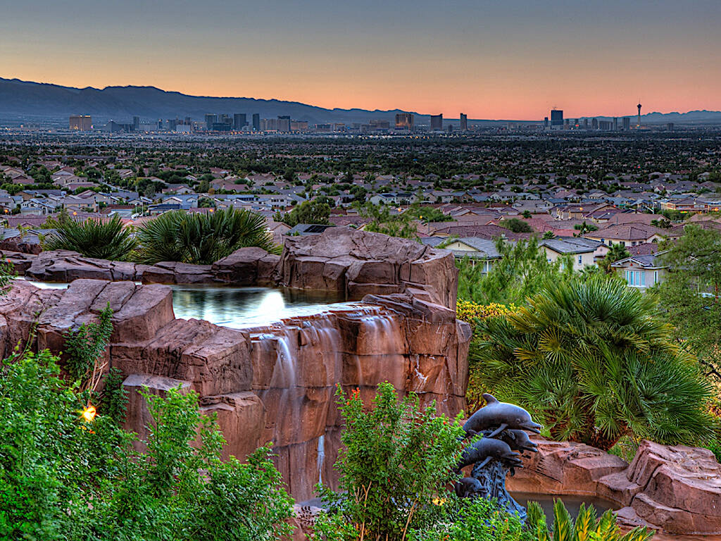 Henderson' MacDonald Highlands offers views of the Las Vegas Strip, water features and lush lan ...