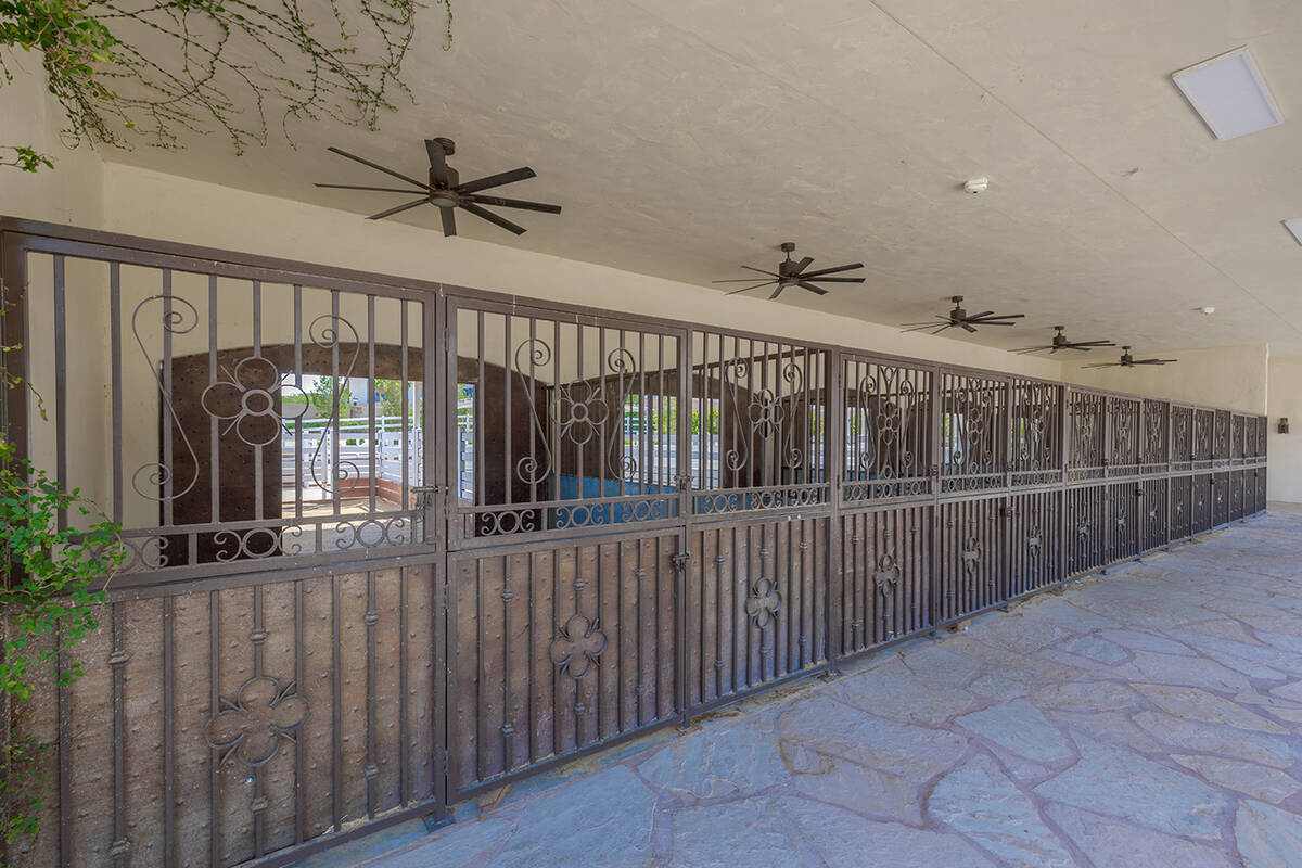 The estate includes seven horse stables with automatic waterers and box stall with an attached ...