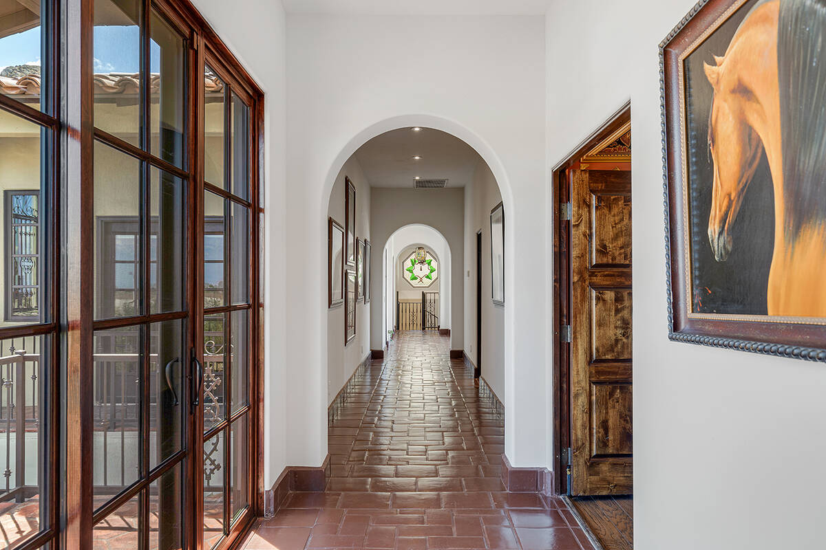 A hallway connects the lower-level rooms. (Ivan Sher Group)