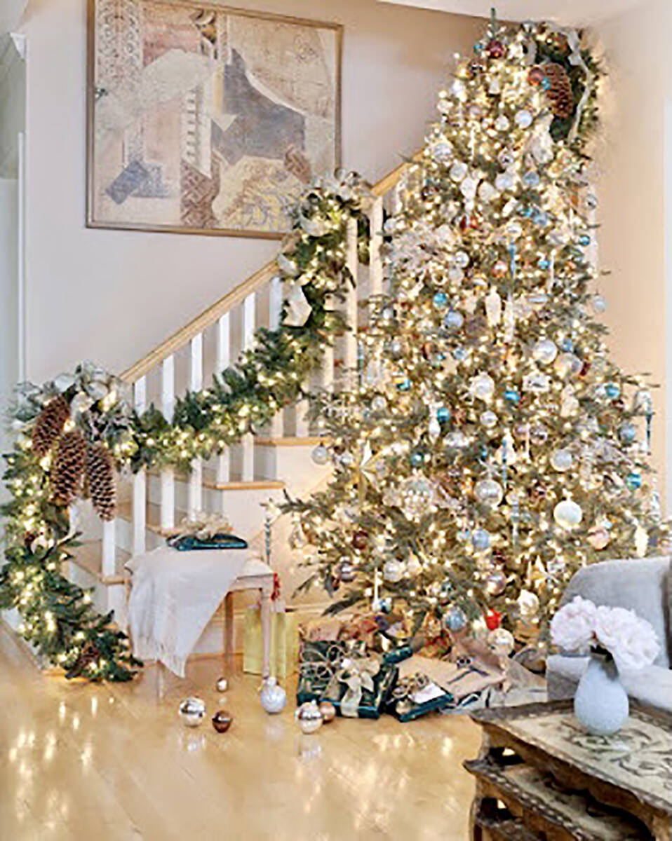 Staircase decorations highlight tree. (Christopher Todd)