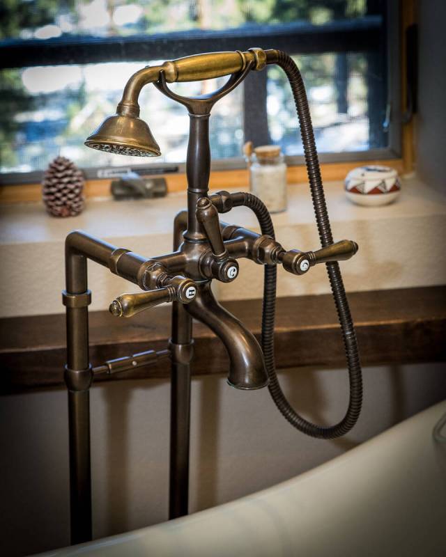 Claw-foot tub features unique faucet. (Tonya Harvey/Real Estate Millions)
