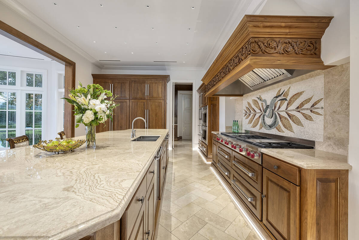 The kitchen has a large island with seating. (Kristen Routh-Silberman)