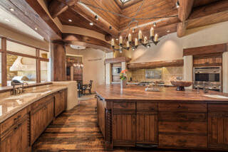 The kitchen features a a mesquite center island, as well as top-of-the-line appliances from Wol ...