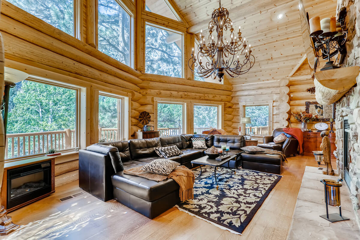 The large windows provide views of the pine forest. (Mt. Charleston Realty)