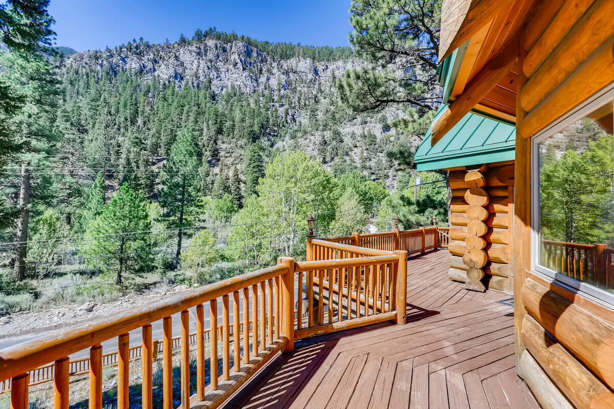 The cabin has a wraparound deck. (Mt. Charleston Realty)