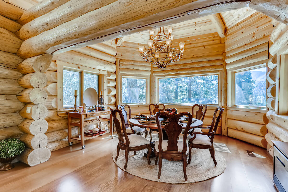 The dining area has large Pella windows that look out into the forest of pine trees. (Mt. Charl ...