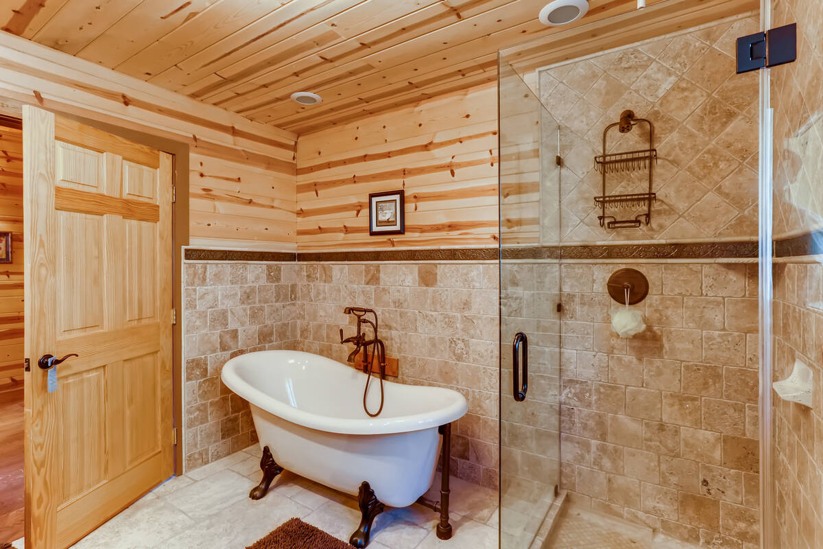 Both baths feature a claw-foot tub to match the rustic tone of the cabin. (Mt. Charleston Realty)