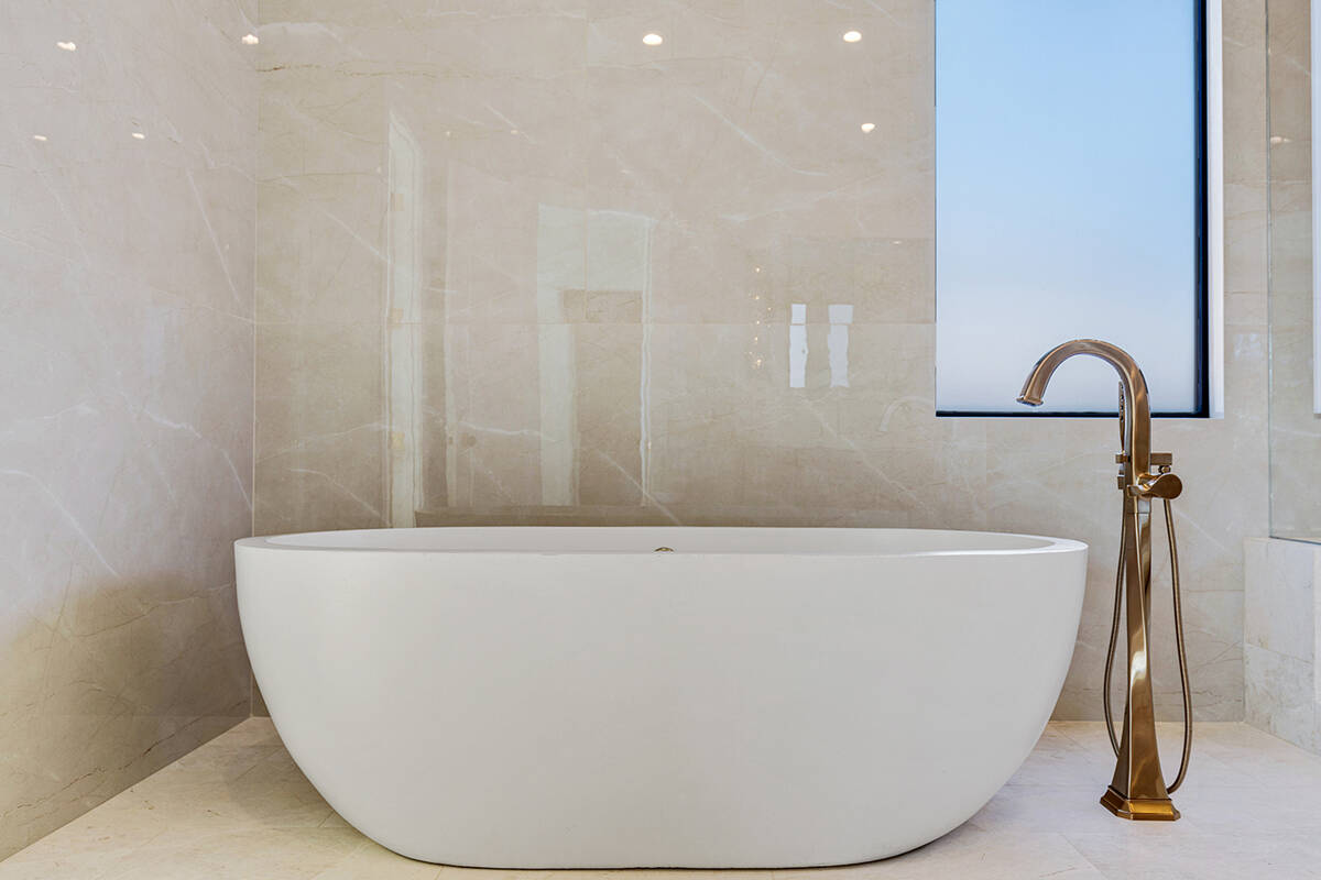 Ivan Sher Group The master bath showcases a freestanding, 1,200-pound concrete soaking tub from ...