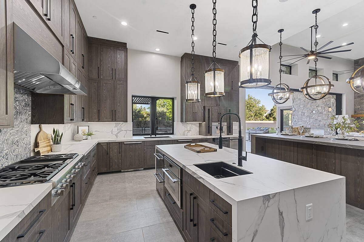 The kitchen features upgraded appliances. (Darin Marques Group)