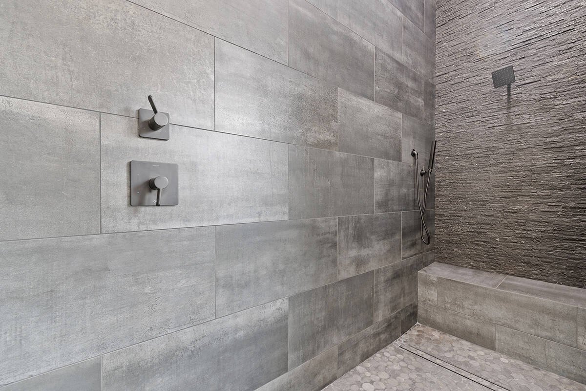 The shower in the second master bath. (Darin Marques Group)