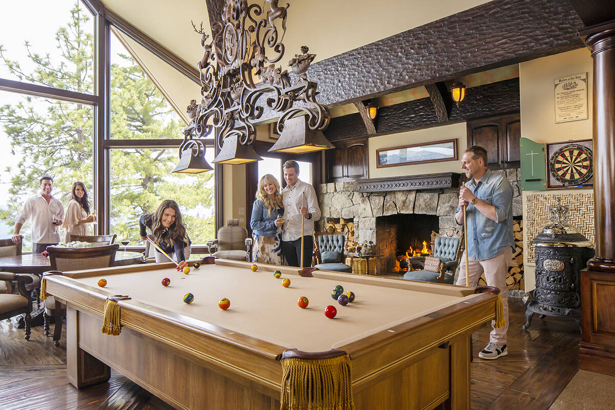 The old English pub-inspired billiards room and bar. (Chase International Realty)