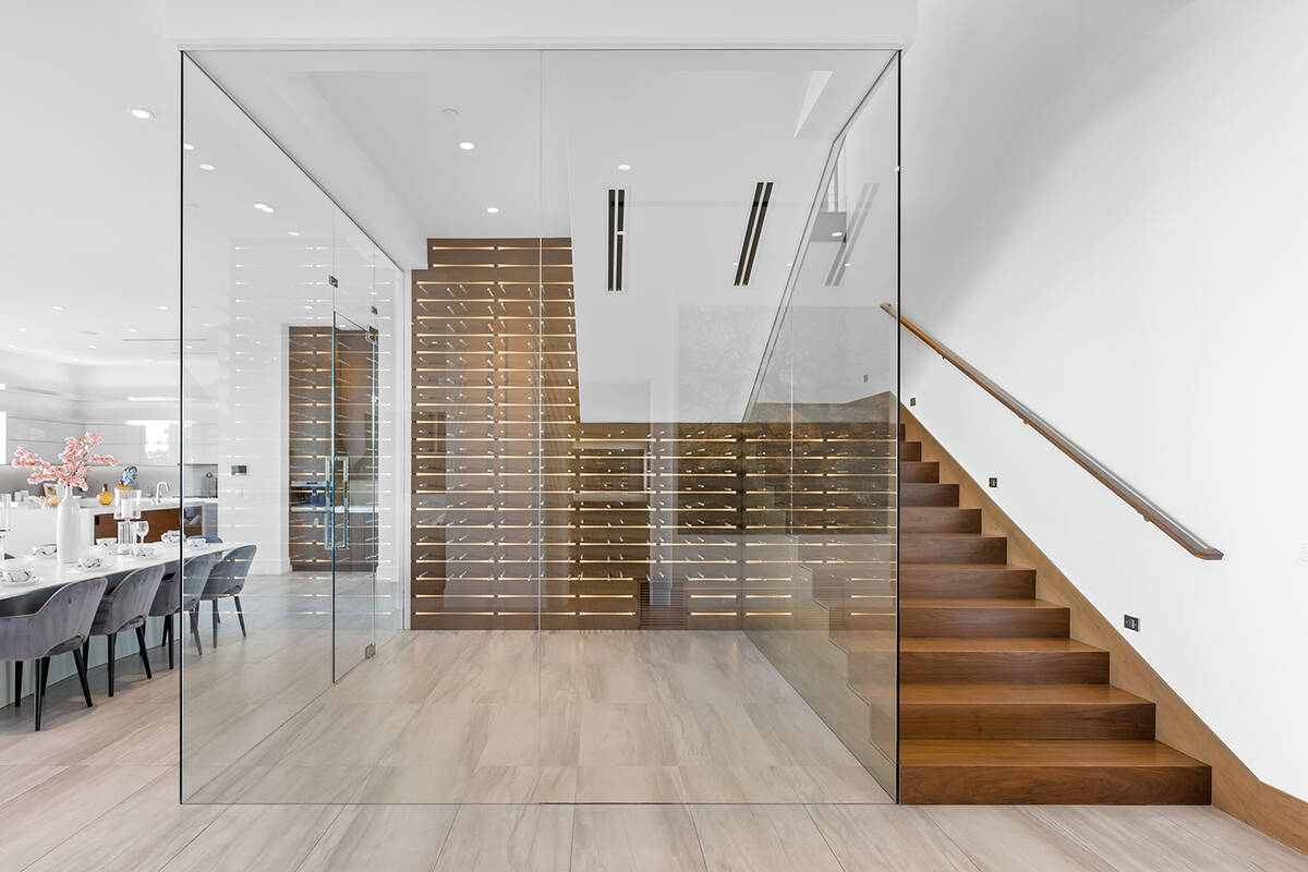 Bordering the wine cellar is a walnut staircase. (Ivan Sher Group)