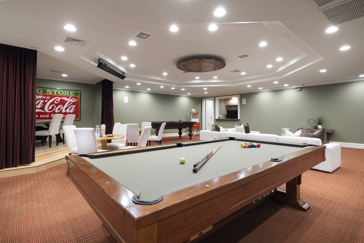 The 21,835-square-foot Tournament Hills mansion features a game room with a kitchenette that ha ...