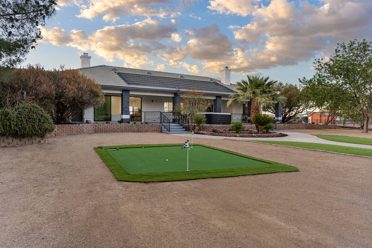 The home has a putting green. (Sotheby’s International Realty)