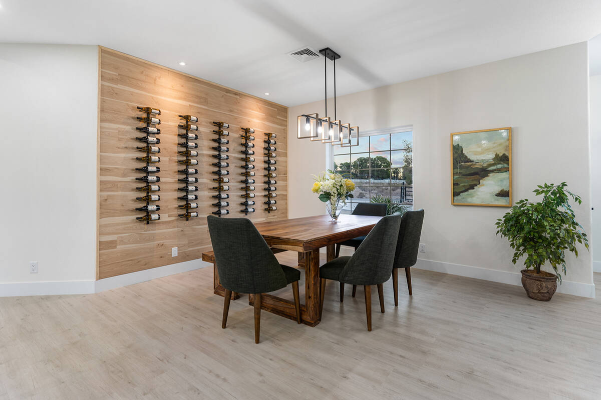 Homeowner and Realtor Natalia Harris designed a wine wall as a focal point for the dining area. ...
