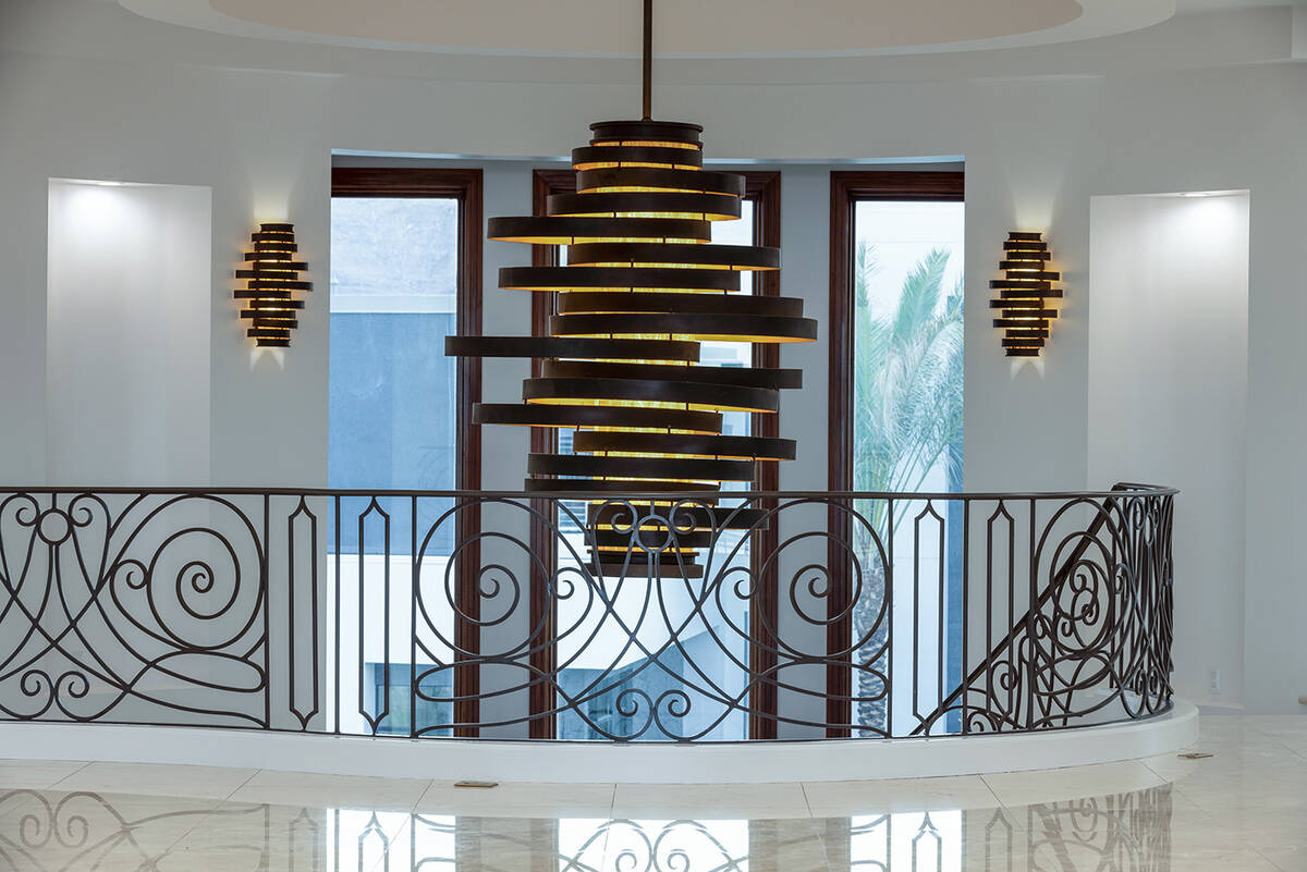 The chandelier is a centerpiece to the home's entrance. (Las Vegas Sotheby’s International)