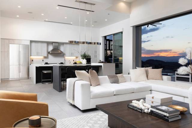 The kitchen leads into the living room. (Corcoran Global Living)