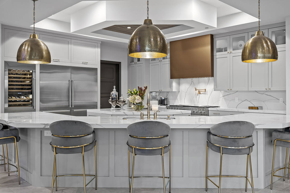 The kitchen features a large island with seating. (Douglas Elliman, Nevada)