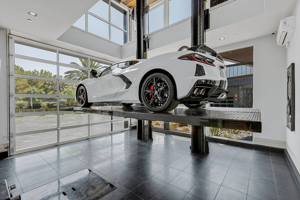 This $32.5 million for a Seven Hills home features a car lift to bring the vehicle to the secon ...