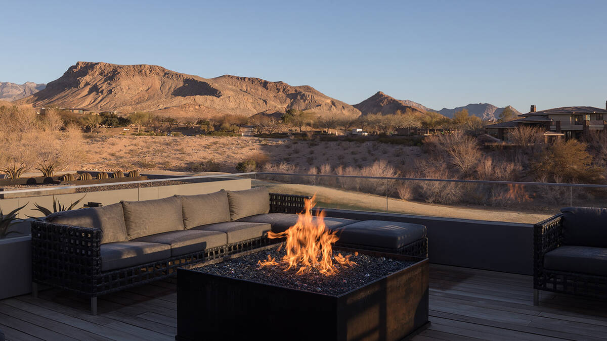 The outdoor living area on the second floor features a fire pit and has beautiful mountain view ...