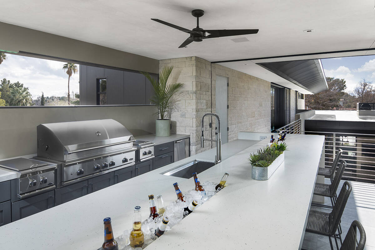 The upstairs outdoor kitchen is connected to the master suite. (Luxus Design Build)