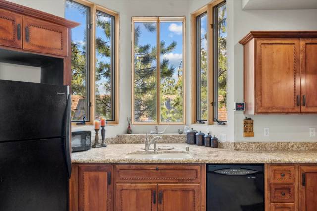 The kitchen window looks into the pine forest. (AVIA Media Group)