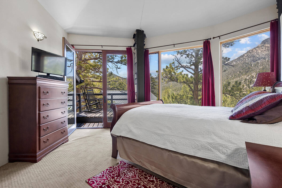 The upstairs master suite has its own private balcony. (AVIA Media Group)