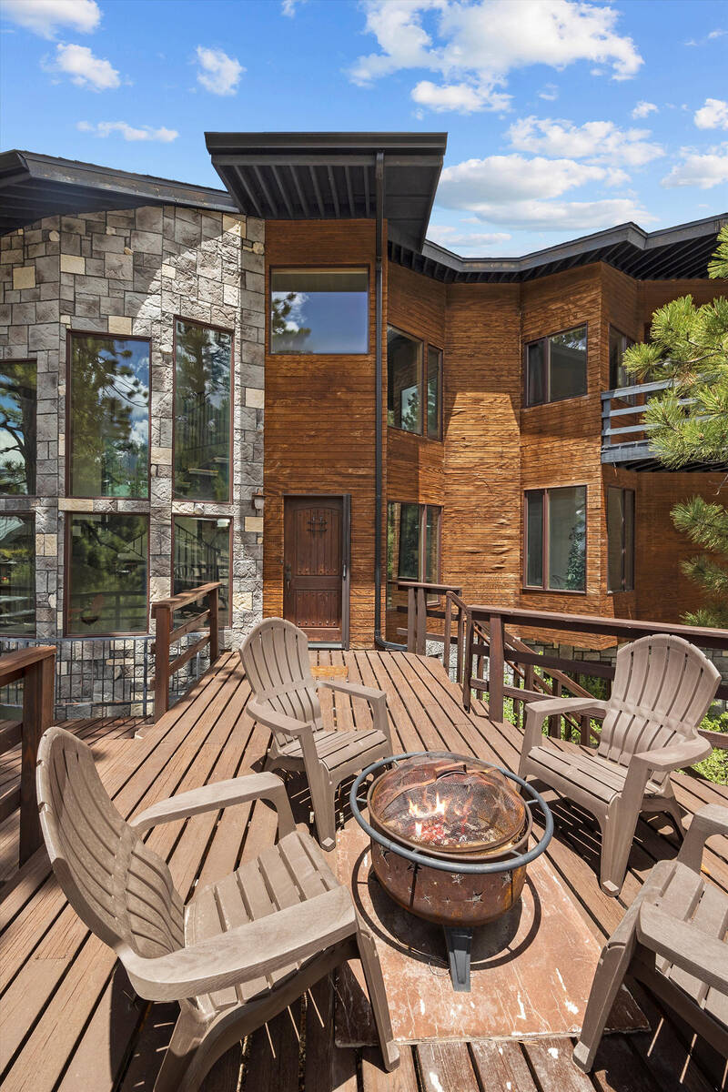 The fire feature on the deck provides a relaxing gathering place after a hike or trip to the ne ...