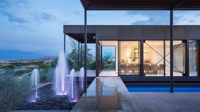 The dining room overlooks a fountain and the swimming pool. (IS Luxury)