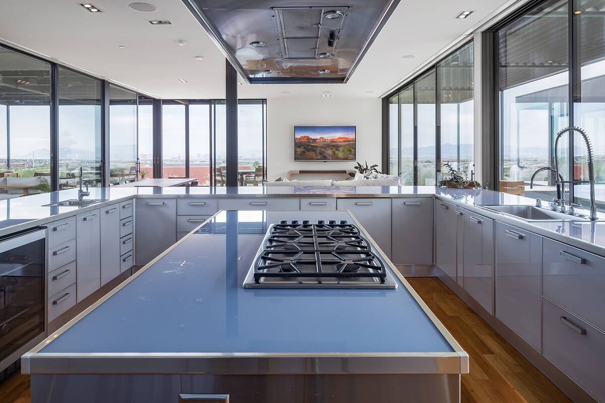 The home has a Scavolini luxury Italian kitchen surrounded by floor-to-ceiling windows. (IS Luxury)