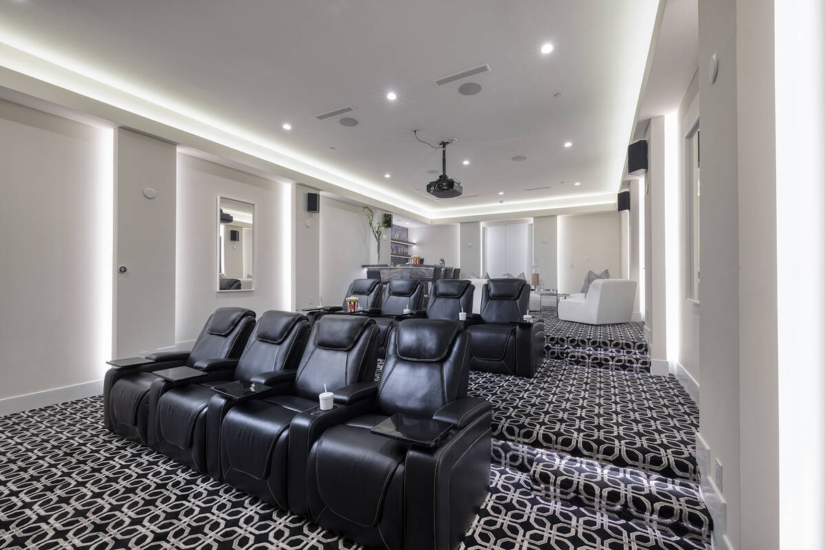 The $10.5 million MacDonald Highlands home has a movie theater, gym, bar with a game area, and ...