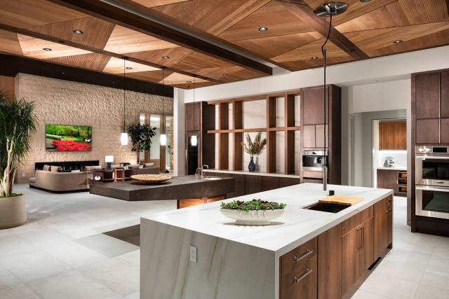 The voluminous open-concept floor plan seamlessly integrates formal living, dining, gourmet kit ...