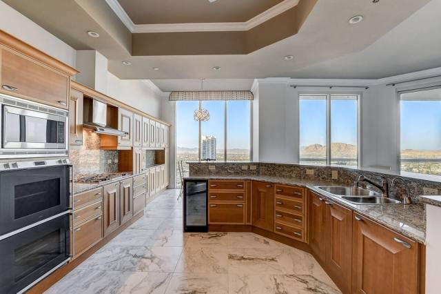 In the kitchen are granite countertops; custom cabinetry, Gaggenau and Sub Zero appliances; cou ...