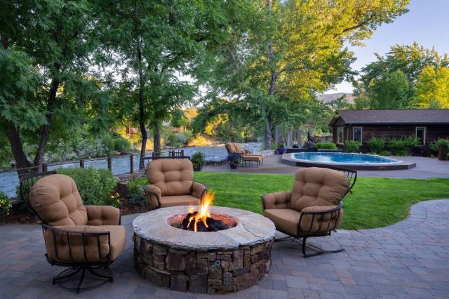 An outdoor sitting area features a fire pit. (Chase International Luxury Real Estate)