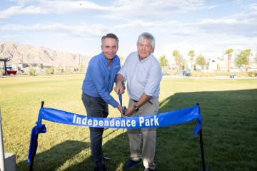 Clark County Commissioner Tick Segerblom and Touchstone Living’s Tom McCormick cut the ribbon ...