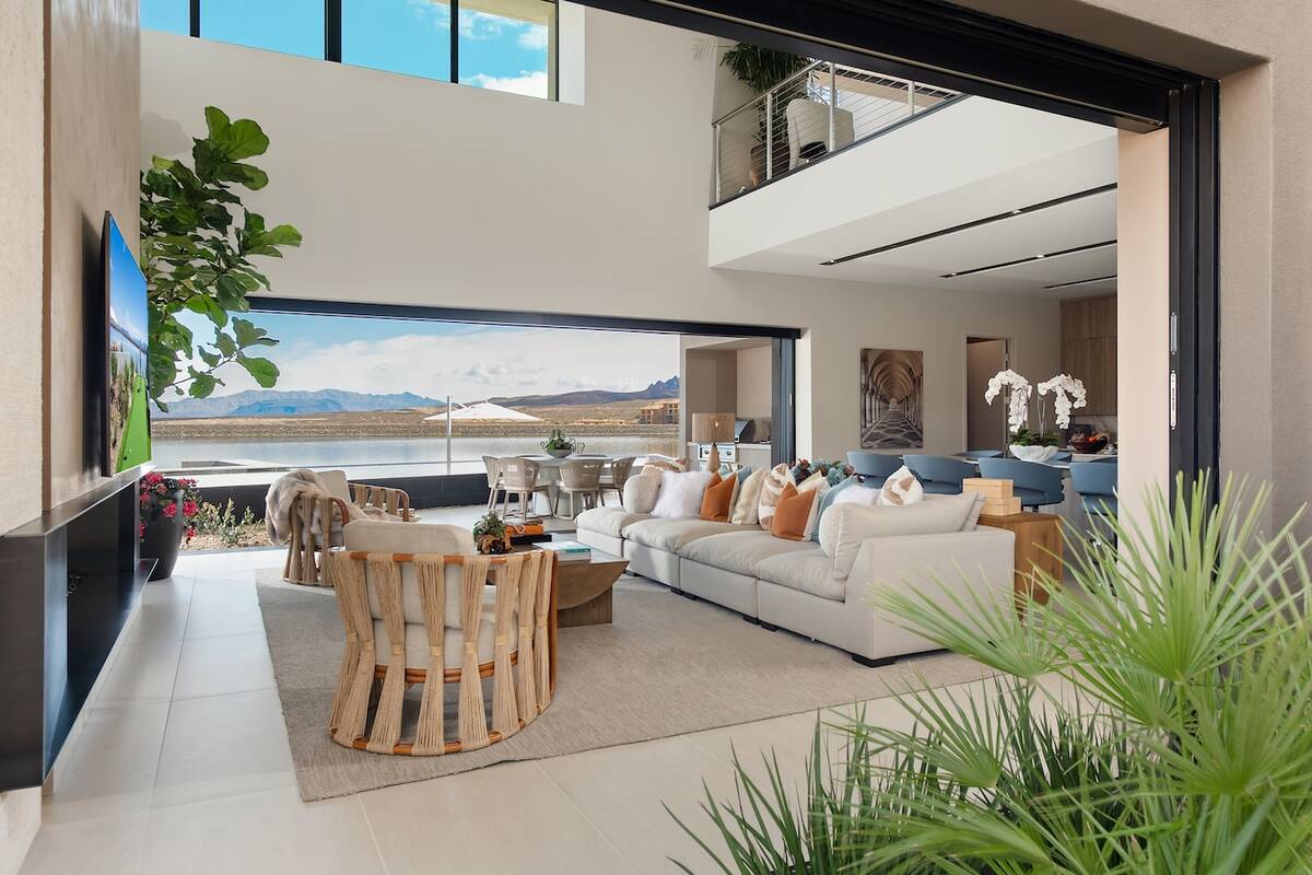 In the Arvada show home, the main level’s curated, signature biophilic floor plan blends the ...