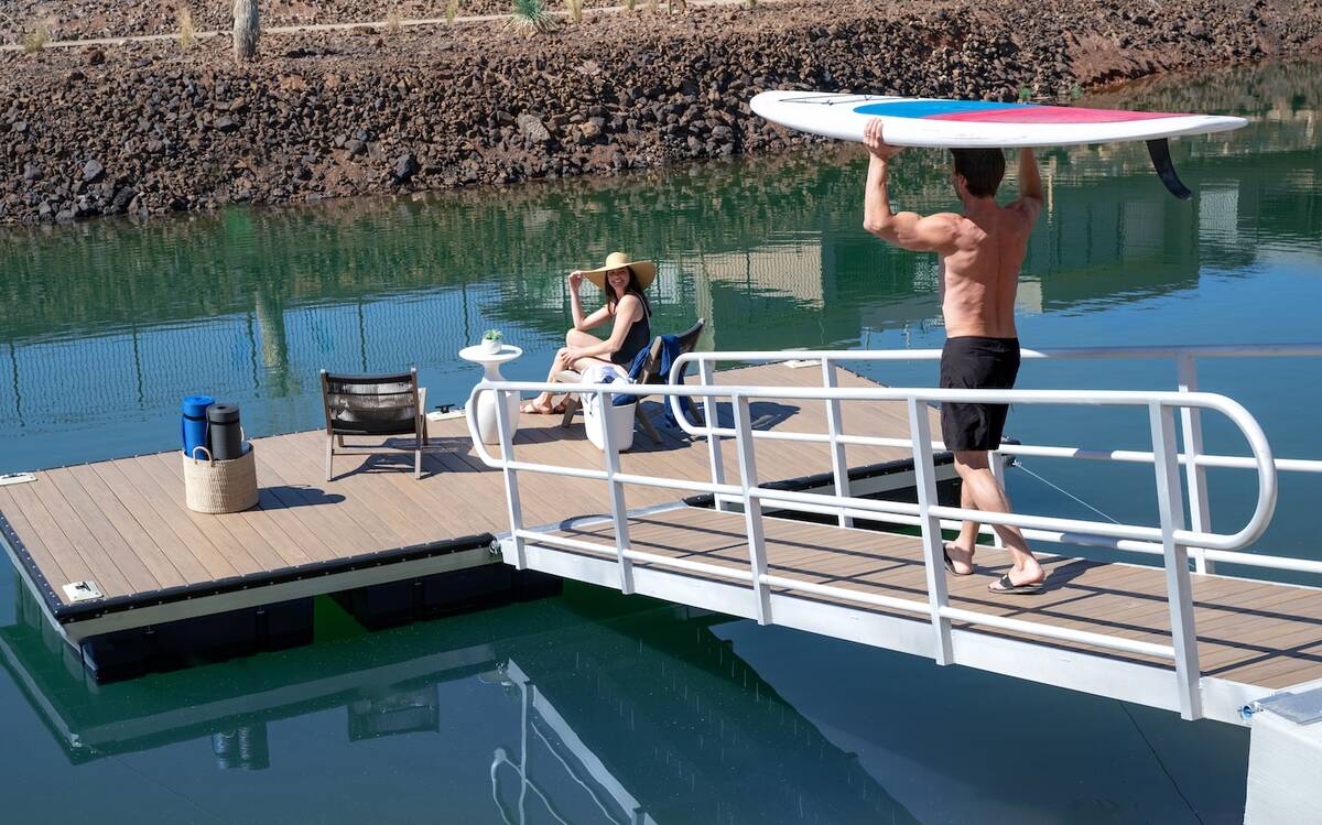 The Velaris show home is a lake-front property and features a boat dock. (Blue Heron)