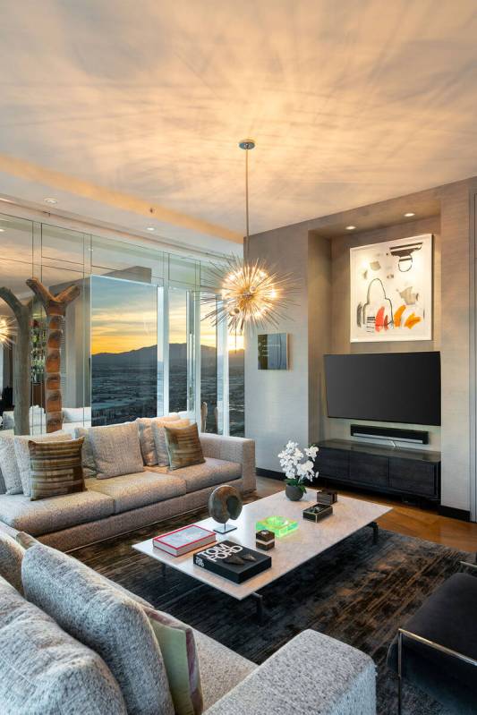 The living room features a modern fireplace. (Berkshire Hathaway Home Services)