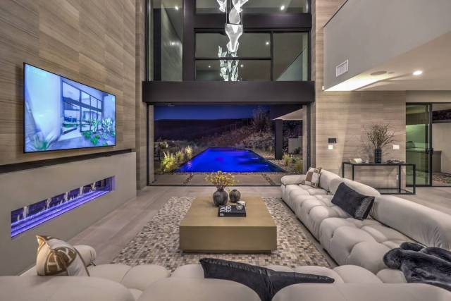 The living room opens to the pool. (Las Vegas Sotheby’s International Realty)