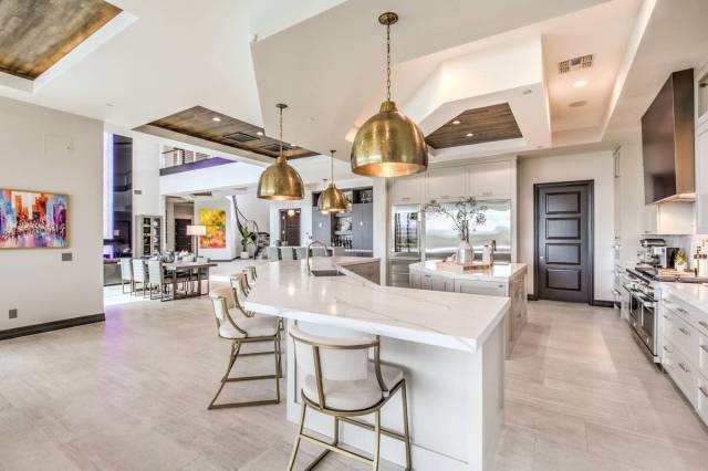 The kitchen leads to the dining area. (Keller Williams Realty Southwest)