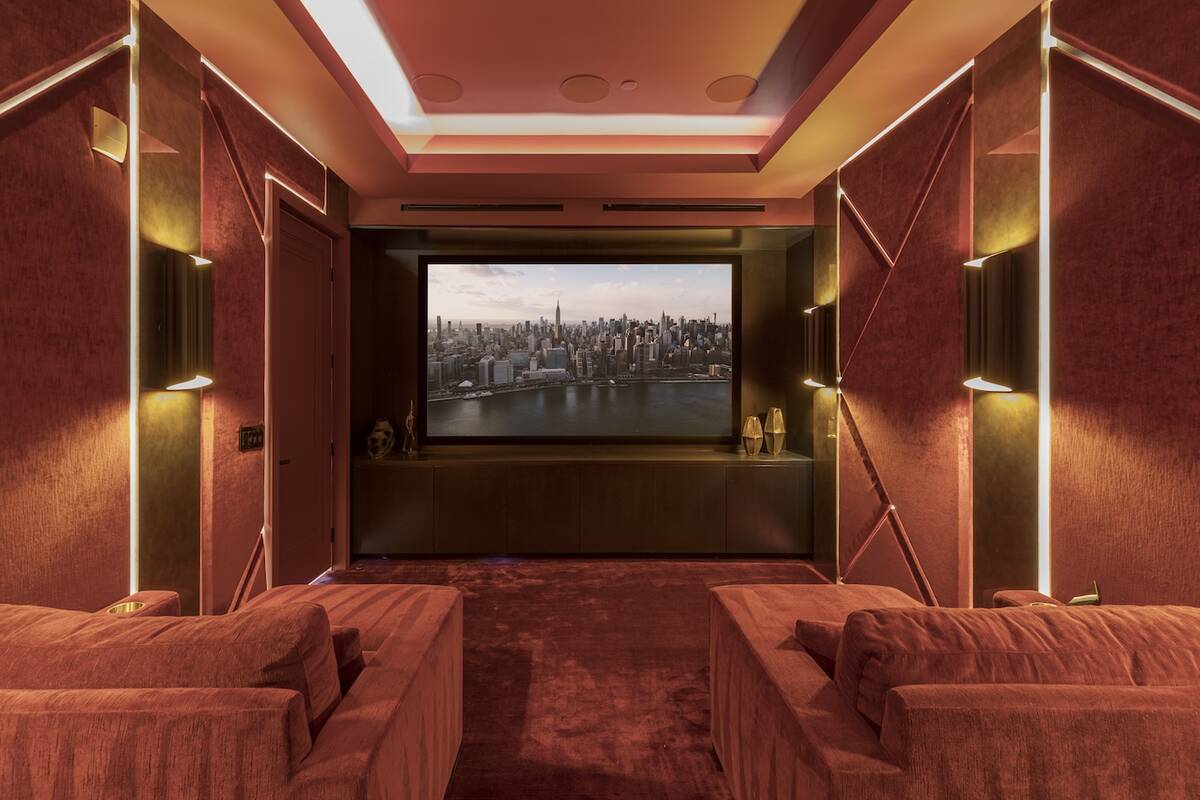 Lusso The home theater is complete with plush red velvet seats, an oversized 130-inch screen, a ...