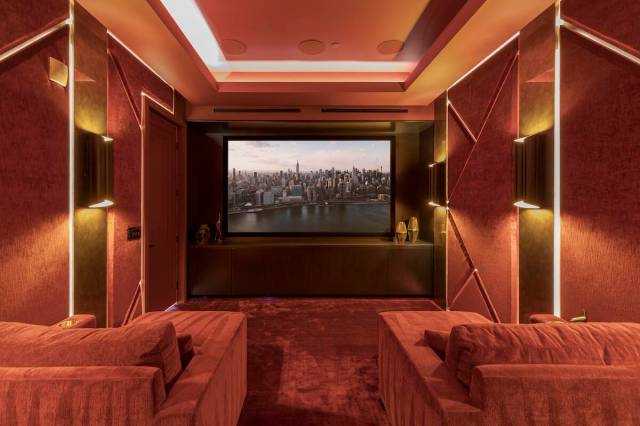 Lusso The home theater is complete with plush red velvet seats, an oversized 130-inch screen, a ...