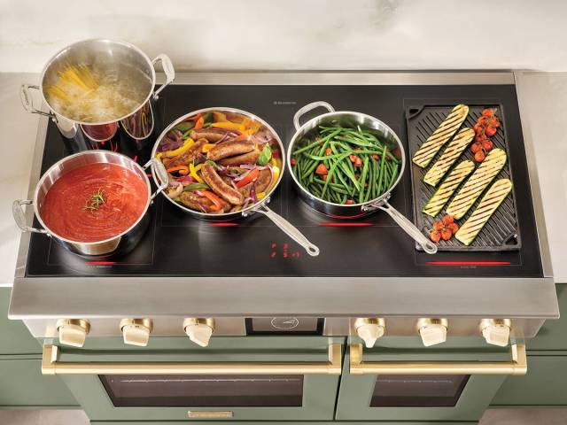 BlueStar's 48-inch Platinum Series Induction Range in oyster white and brushed pewter trim with ...