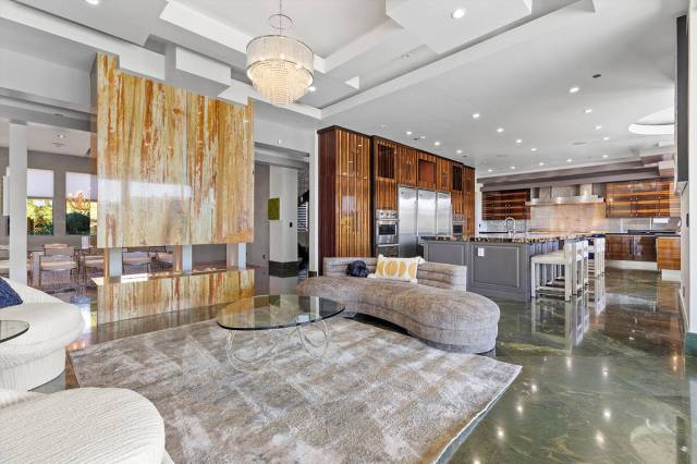 The two-story home with a basement measures 14,703 square feet. It has seven bedrooms, 13 baths ...