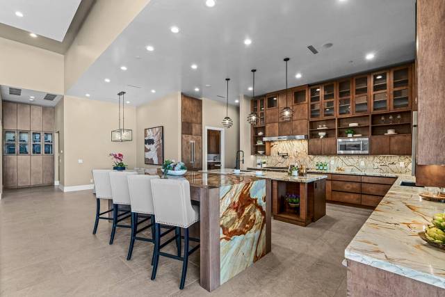 The kitchen has a "party" island with seating. (Stetson Ybarra/Rooted Elements)