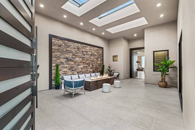 The home makes a strong impression from the moment of entry. A Dutch door leads into the cozy f ...