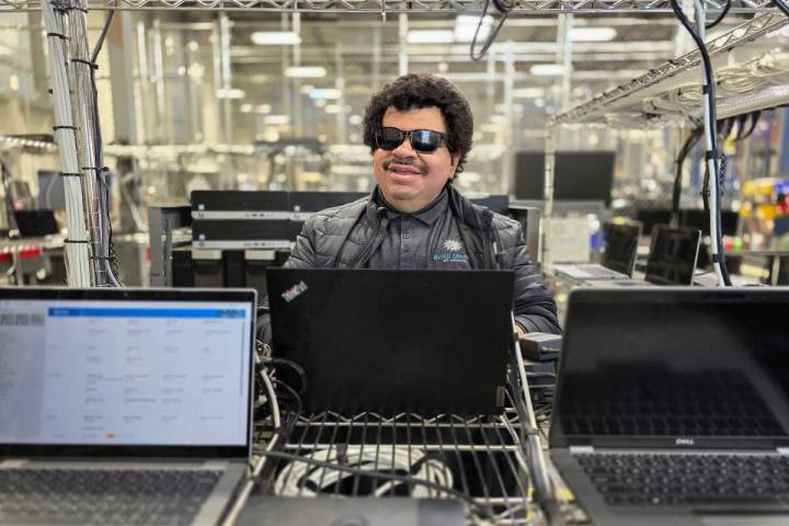 Cristobal Sotelo diagnoses issues in the Tech Department at The Blind Center of Nevada’s Elec ...
