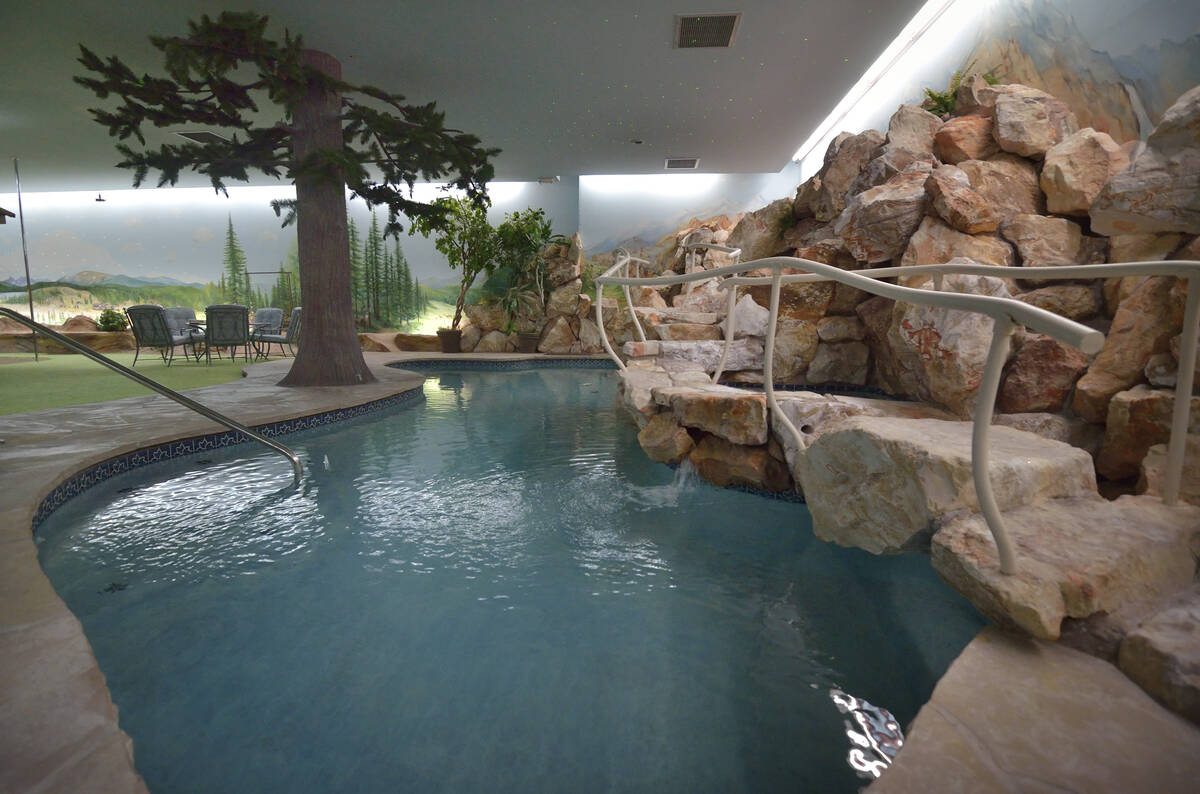 This underground residence includes a four-hole putting green, two hot tubs, sauna, dance floor ...