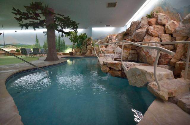 This underground residence includes a four-hole putting green, two hot tubs, sauna, dance floor ...